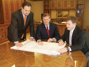 Michael, left, and Christopher Vecellio with their father, Leo Vecellio, Jr., at the office in 2007.